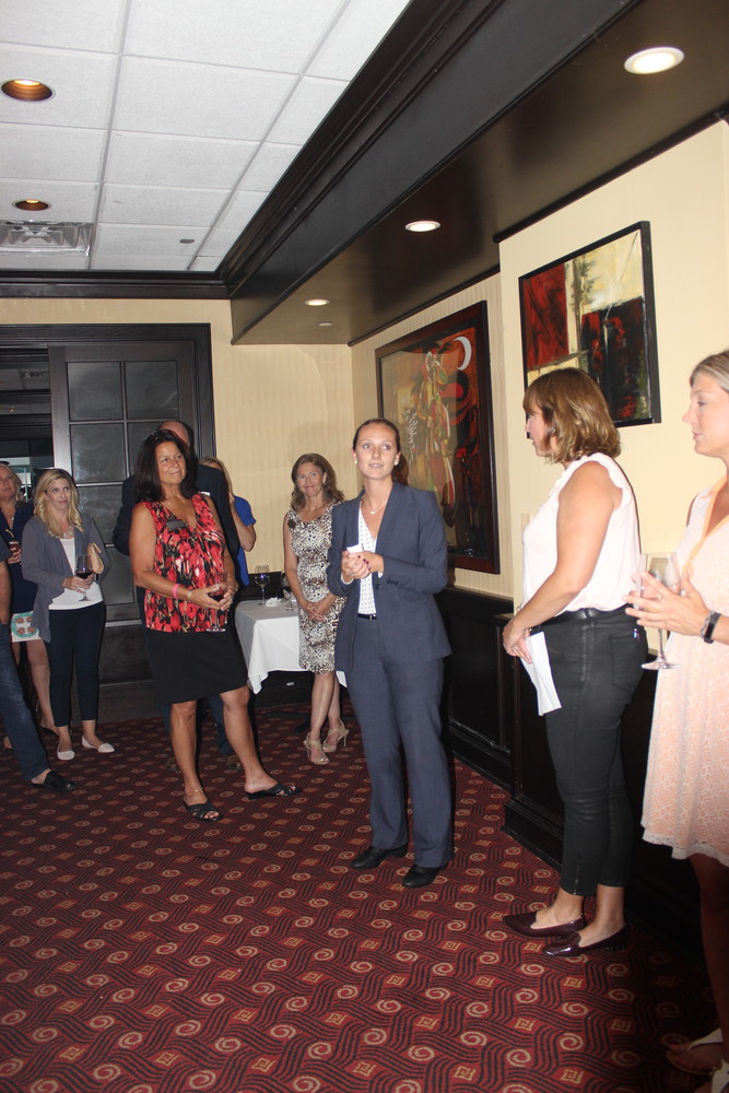 Ruth’s Chris Steak House general manager Christine Griggs addresses attendees of the Chamber “After Hours” on June 27.